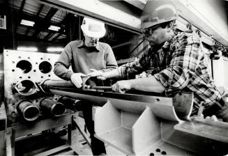 Pency Pearson who developed the bagging technique demonstrates the should plug installation tool