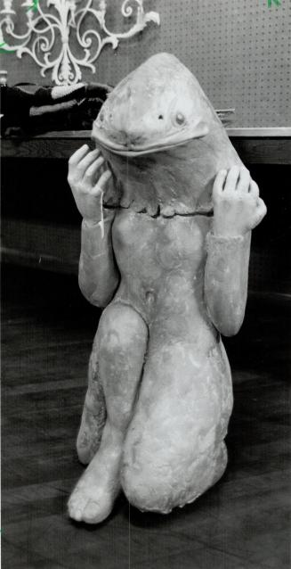 Fish lady: This glazed stoneware figure of a mythical fish woman is just one of hundred of items auctioned off