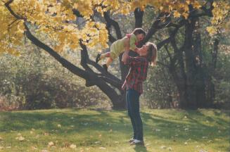 Fall fling: Catherine Politis and daughter Alexandra, 2, romp at Serena Gundy Park in North York yesterday