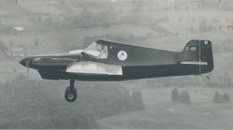 Midget Pylon Racer - so small that pilot William Brubacher said he felt he was wearing it rather than flying it -made its maiden flight yesterday at G(...)