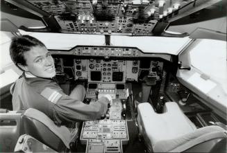 At the controls: Capt. Steve Heimburger sits in the cockpit of a luxurious A-310 Airbus that comes complete with two beds, a shower and kitchen space