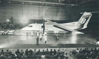 The spotlit star turn in a broadloomed hangar for a select audience of 1,600 guests yesterday was de Havilland's Dash 8 Commuter airliner