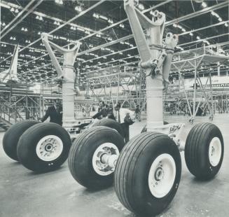 Clusters of wheels for TriStars - minus the aircraft - undergo inspection at the Lockheed plant