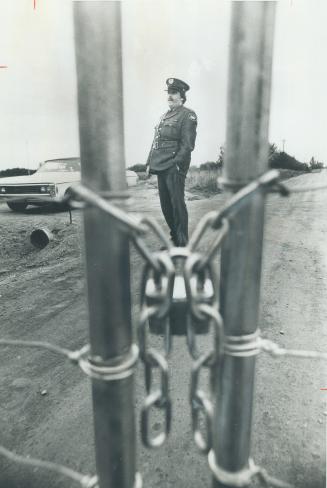 Padlocked gates blocked some roads on the site of the proposed airport at Pickering yesterday, protected by security guards working for the federal go(...)