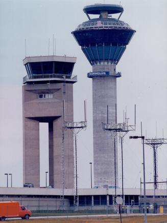 New tower (left) nears completion