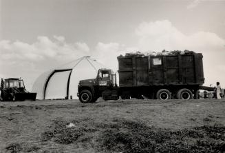 Is it safe? Raw garbage from airplanes is delivered to a hangar, left, where it is compressed into pellets and stored