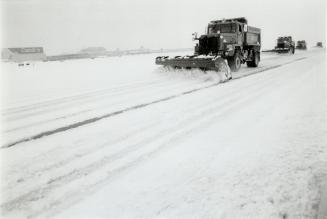 Trail blazer: Snowplows head down Pearson International Airport's longest runway after last week's early taste of winter