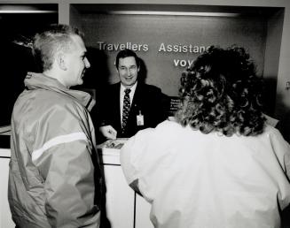 Rein Pater, with the Travellers Aid booth at Pearson International's Terminal 1, gives guidance and assistance to new arrivals