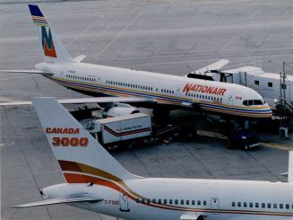 Still aloft: Nationair staved off forced bankruptcy yesterday when it paid $13,000 to the Quebec Inn after the hoteller filed a petition in Quebec Superior Court