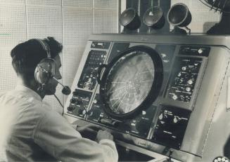 Controller watches planes on radar