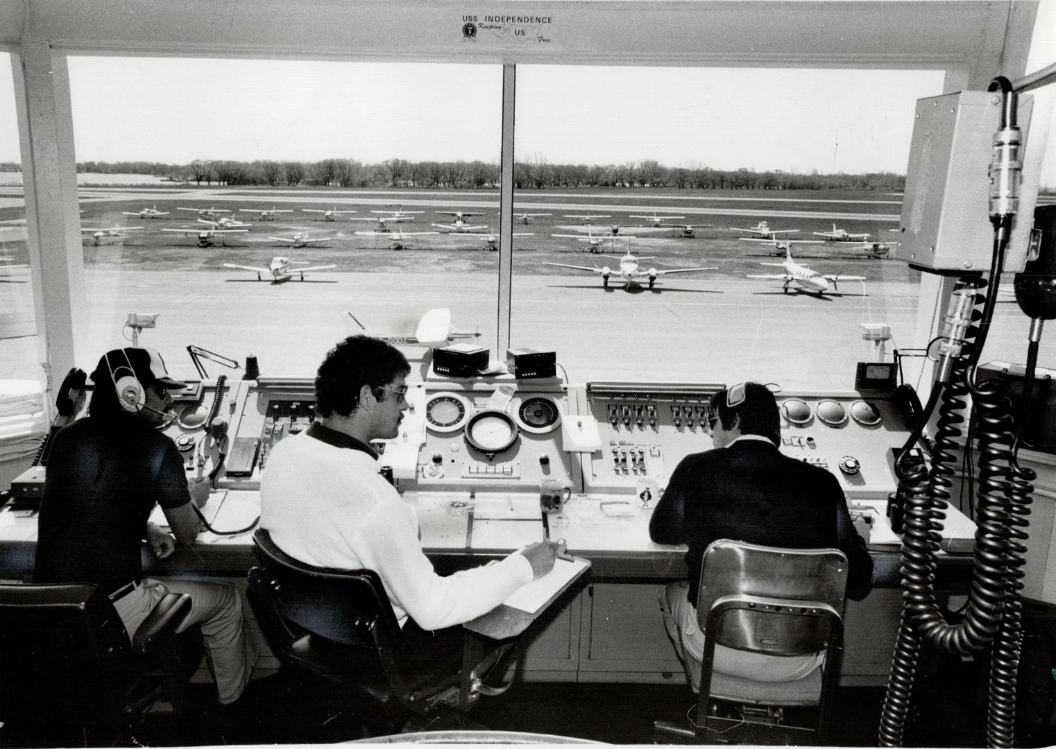 Nerve centre: Air traffic controllers in the Toronto Island Airport control tower, built in 1953, handled 213,795 takeoffs and landings last year