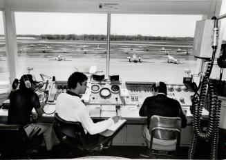 Nerve centre: Air traffic controllers in the Toronto Island Airport control tower, built in 1953, handled 213,795 takeoffs and landings last year