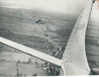 A glider 2,000 feet above Canadian Forces Base at Trenton drops the towing line so Lt