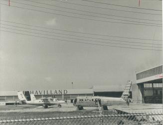 Two Aircraft stand outside the de Havilland Aircraft of Canada plant in Downsview, where 600 to 700 men will be laid off before the end of the year be(...)