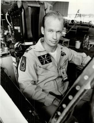 Set for Star Wars. Maj. Gordon Todd of Canadian Armed Forces in cockpit of FA-18 Hornet at U.S. naval air test centre, Patuxent, Md., is surrounded by electronic equipment and computer controls