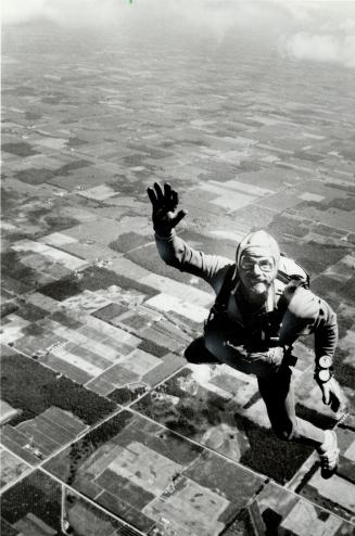 Ground bound: A candidate for Canada's sport parachuting team waves farewell on practice jump near Simcoe as the men's and women's teams prepare for world tests in Czechoslovakia