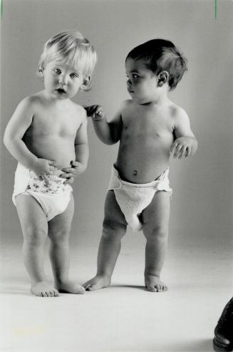 Little differences: Jeremy Pearl, left, 14 months, sports a disposable diaper, while his 13-month-old pal, David Dennis, wears an updated cloth version