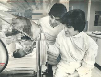 Angela and Gabriele Camaioni gaze in loving wonder at their son Alfonso, born 12 weeks prematurely on May 17 and weighing only 2 pounds, 1/2 ounce. Th(...)