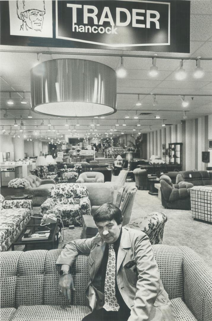 Forlorn Among Furniture in quiet Trader Hancock TV and Appliance store in Eaton Centre, salesman Roy Ellis, 37, who expects to become a father in Dece(...)