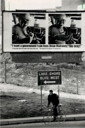 Postal unions send message. A bike rider passes by an attention-grabbing billboard at Lake Shore Blvd. and Parliament St. The billboard, which depicts(...)