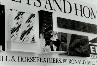 Live on the spot. Adrian Herschell, manager of Ginger's Bath Centre, takes his turn on a 48-foot-by-14-foot three-dimensional billboard at Bloor and P(...)