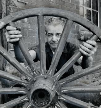 Retreading wagon wheels is another Blacksmith's Job