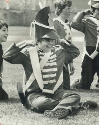 The roar of the muskets was too much for this youngster, who kept his ears well plugged