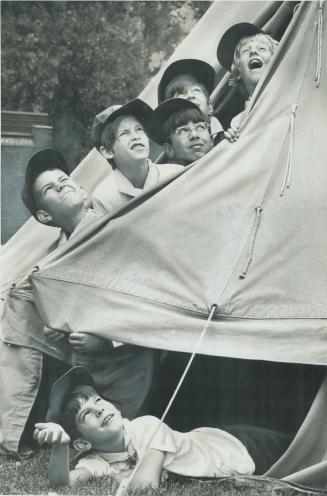 Even if it rains: Snug in their tent at a Boy Scout Jamboree on Toronto island in 1975
