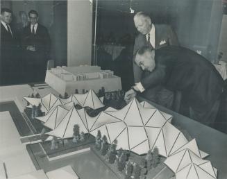 What! no walls? Ontario's Minister of Economics and Development Stanley Randall shows Premier John Robarts the architect's model of Ontario's wall-les(...)