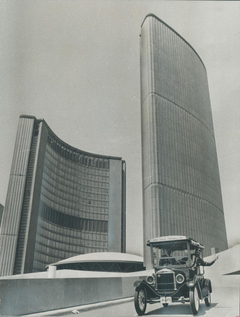 Owner Jack Lillico waves from his 1926 vintage Model T Ford Depot Hack as he coasts down the sleekly modern ramp of Toronto City Hall. Car's Vancouver(...)