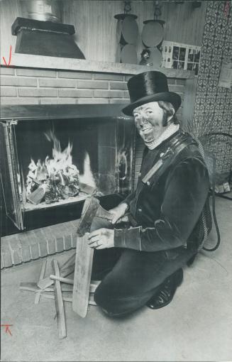 His own fireplace wlcomes Norman Lenz after a day spent cleaning other people's chimneys