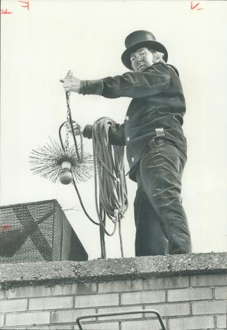 Spiral Brush with attached weight, held by Lenz, is the type used by chimney sweeps for 700 years
