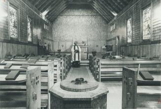The Anglican Church in Windermere, in Muskoka, has designs etched into the wood of the baptismal font (foreground), pews, altar and walls, to the deli(...)