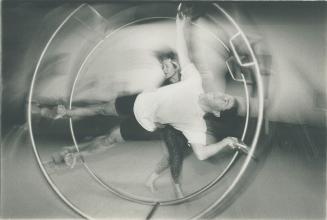 Marsha Kennington instructs George Soare on the wheel of death, top