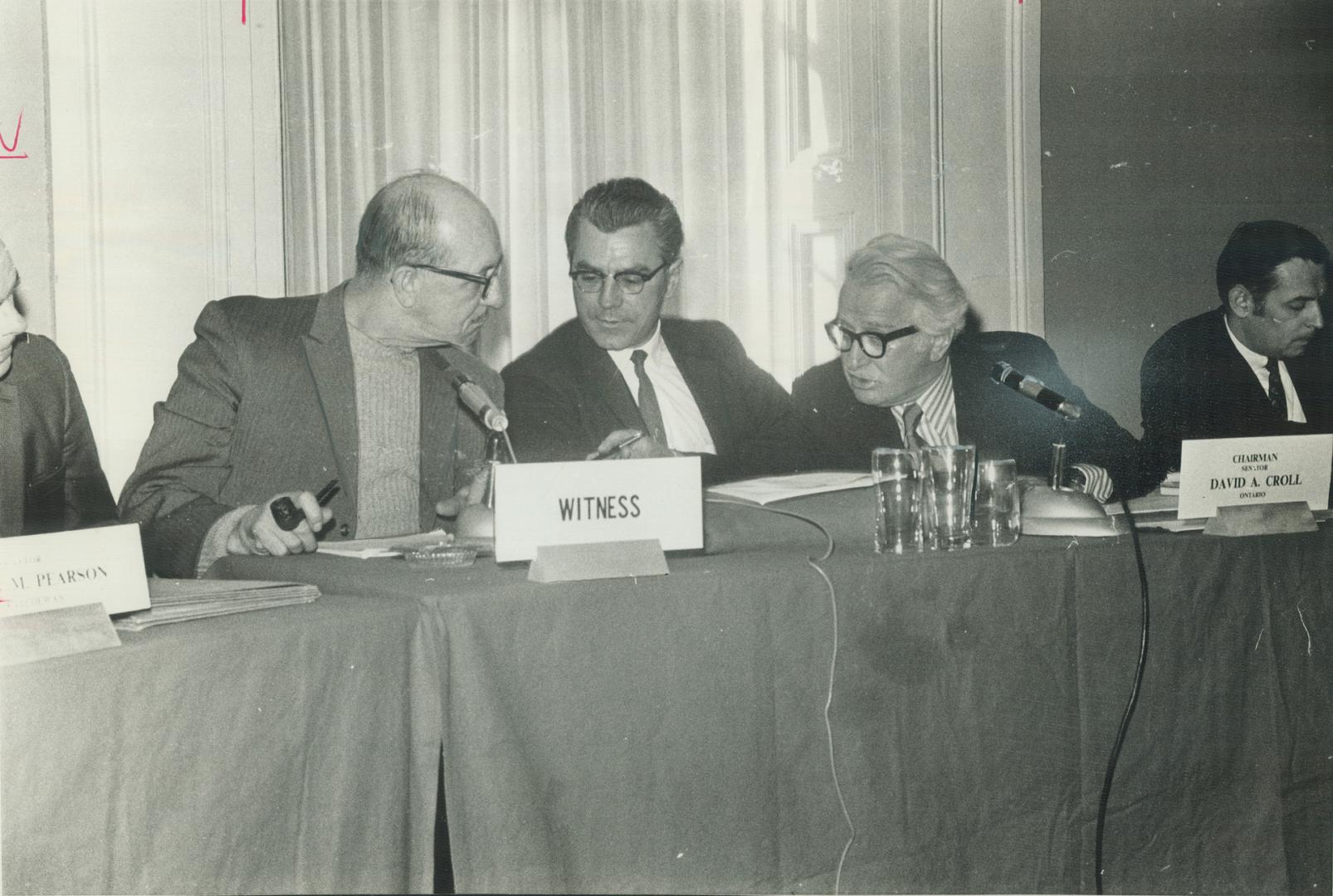 Urging more aid for injured workmen, Al Baldwin (left) and John Nevue (centre) of The Just Society's Workmen's compensation committee, talk to Senator(...)