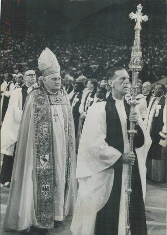 Richly Robed Archbishop of Canterbury (left) enters Maple Leaf Gardens