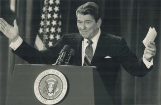 Standing ovation: President Ronald Regan smiles with pleasure as he gets a standing ovation on the summit's final day
