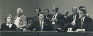 Collective wisdom: Margaret Thatcher and Ronald Reagan listen as Brian Mulroney, right, reads final communique at Roy Thomson Hall