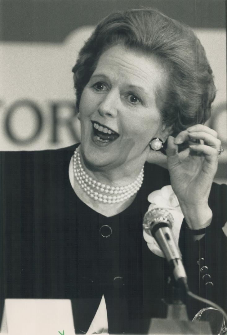Maggie shines: Iron Lady Thatcher, speaking at press conference, was judged summit star