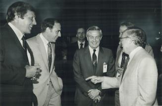 Good point: Ontario Deputy Minister Robert Welch (right) tries a witticism on (from left) Attorney-General Roy McMurtry, New foundland Premier Brian Peckford and Alberta's Peter Lougheed