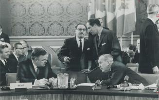 Around the conference table at opening session of dominion-provincial constitutional conference in Ottawa yesterday, there were meetings-within-the-me(...)