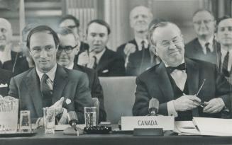 The curtain fell on a happy note yesterday at the historic three-day constitutional conference in Ottawa as Prime Minister Lester Pearson (right) remo(...)