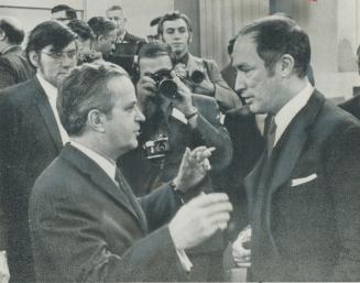 Prime Minister Pierre Trudeau, right, warmly welcomes Quebec Premier Jean-Jacques Bertrand to Ottawa's old Union Station today for talks on bread-and-(...)