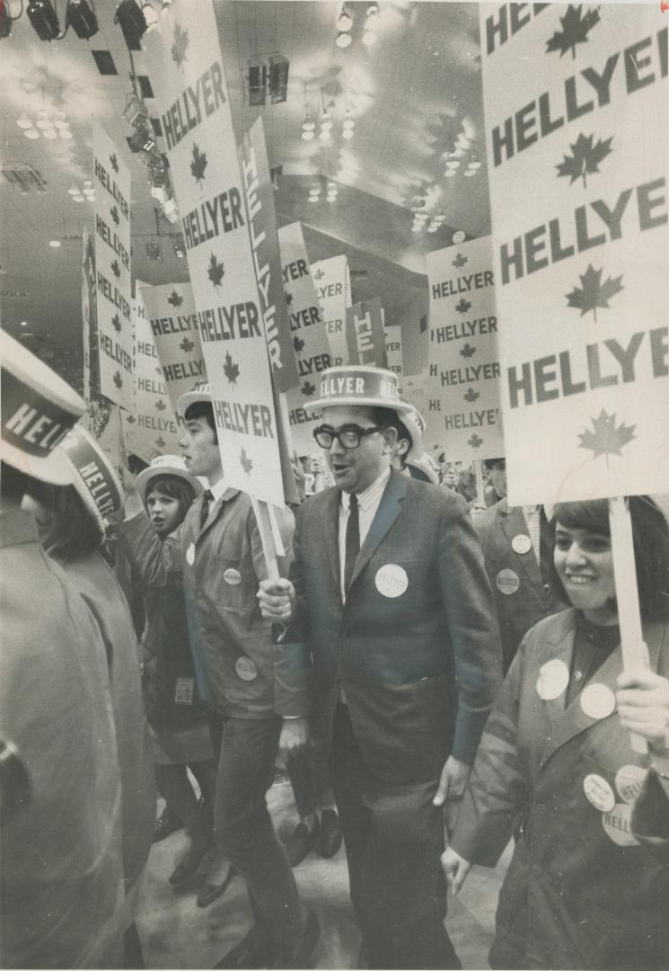 aneous As can be, an owlishly bemused look on his face, a mer on his balding head, a Hellyer placard clutched in his hand, Jack Brehl marches in the c(...)