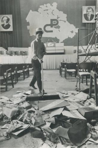 A clean sweep of the convention floor is made by Maple Leaf Gardens worker, cleaning up the rubble left over after Friday's afternoon demonstrations, (...)