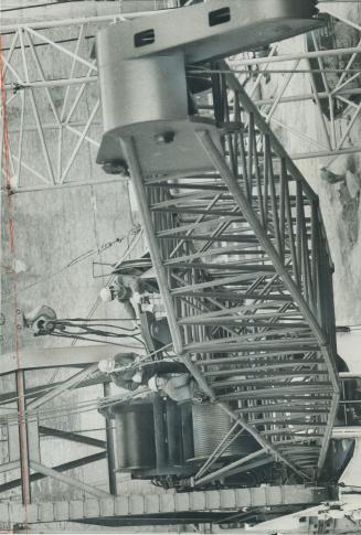 are shown assembling Australian-Designed Crane [Incomplete]