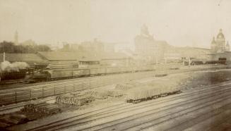 Image shows a track view with the Union station in the background.