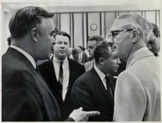 Ontario Premier John Robarts, (left) talks with Finance Minister Walter Gordon at federal-provincial conference which wound up in Ottawa Saturday. Rev(...)