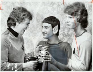 Reliving the good old days of Star Trek at Trekkies convention were Ray Shier (left), 15, dressed as Captain Kirk, and George Hollo, 13, emulating Mr.(...)