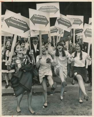 Exuberant fans whoop it up with a rousing prevoting demonstration at Maple Leaf Gardens today before the vorting machines tallying the count in the Co(...)